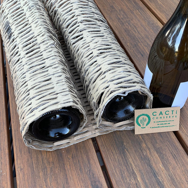 Glass wine bottles wrapped in Perforated Cardboard Wrap